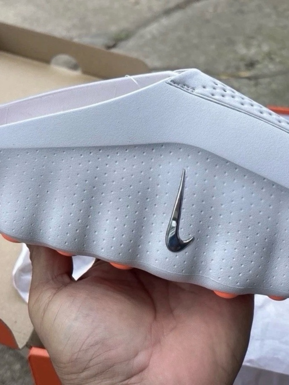 Nike Women's White Slide with Silver Swoosh and Orange Accents